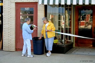 Donna Ferguson (blue jacket) and Sally Stenbroten working on the ribbon for the ceremonial ribbon cutting to be held the next day.